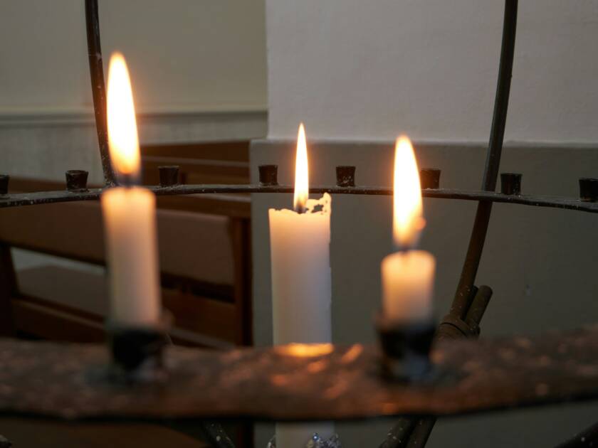 Three lighted candles